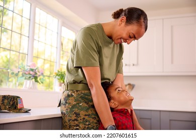 American Army Mother In Uniform Home On Leave Hugging Son In Family Kitchen - Powered by Shutterstock