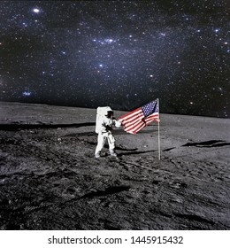 American astronaut landed and set his national flag on the planet. Spaceman explore unknown planet. Outer space. Elements of this image furnished by NASA  - Powered by Shutterstock