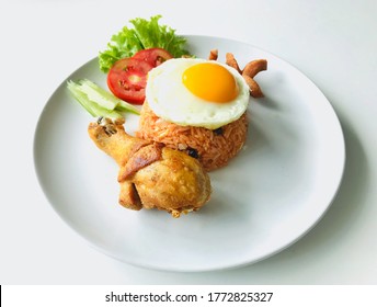 The American Breakfast, Consist Of Fried Egg, Chicken, Sausage, Rice And Vegetable