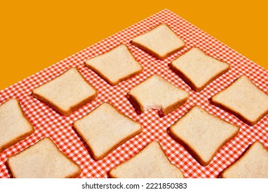 American breakfast. Perfectionism and minimalism. Uncooked bread toasts on plaid red and white tablecloth background. Food pop art photography. Vintage, retro 80s, 70s style.