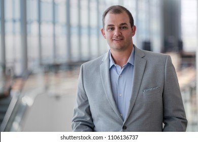 American Business Corporate Sales Person Portrait In Large Building Hall