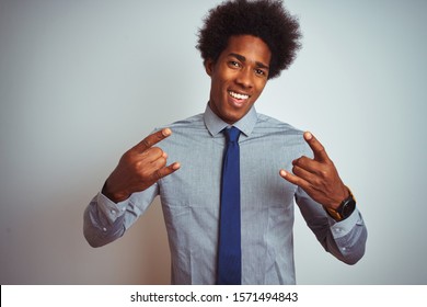 American Business Man With Afro Hair Wearing Shirt And Tie Over Isolated White Background Shouting With Crazy Expression Doing Rock Symbol With Hands Up. Music Star. Heavy Concept.