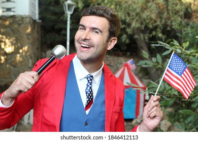 American Businessman Holding Microphone And Flag
