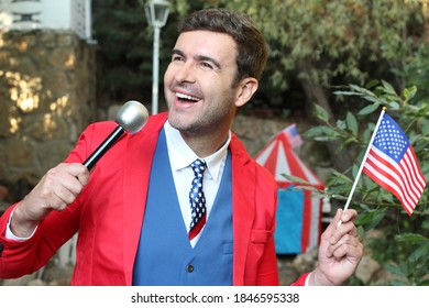 American Businessman Holding Microphone And Flag