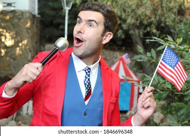 American Businessman Holding Microphone And Flag