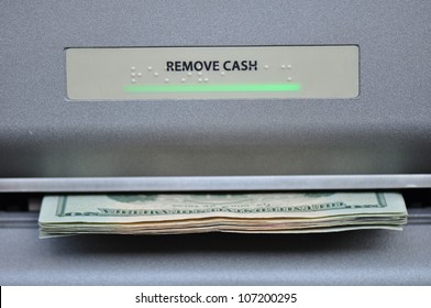 American Cash Being Dispensed From A Bank Automated Teller Machine, Or ATM