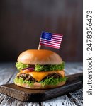 American Cheese Burger with tiny USA flag, celebrating 4th of July, food blog, American food, USA flag, outdoors, independence day