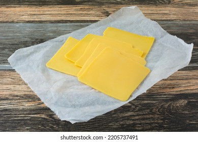 American Cheese Slice Cold Cuts On Deli Butcher Paper On Table