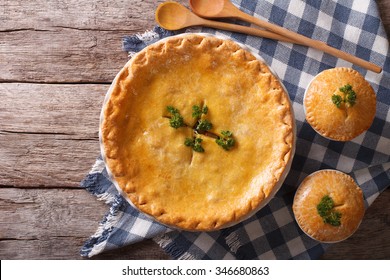 American Chicken Pot Pie In The Baking Dish On The Table. Horizontal View From Above
