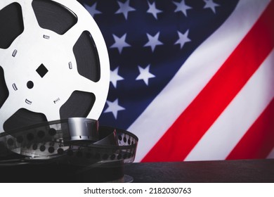 American cinema  Cinematography in the USA  Old film reel the background the flag America 