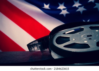 American cinema  Cinematography in the USA  Old film reel the background the flag America 