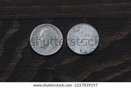 American coin one dime on a wooden table