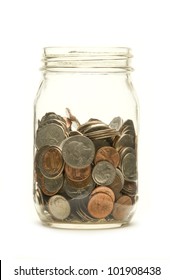 American Coins In A Glass Jar Against A White Background