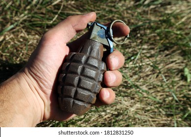 American Combat Grenade In A Man's Hand