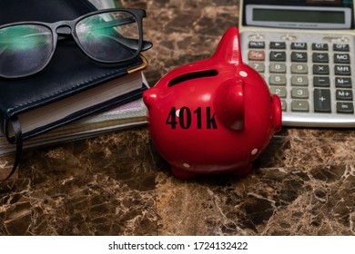 American concept of retirement savings with a piggy Bank against the background of glasses and a daily planner on a marble table