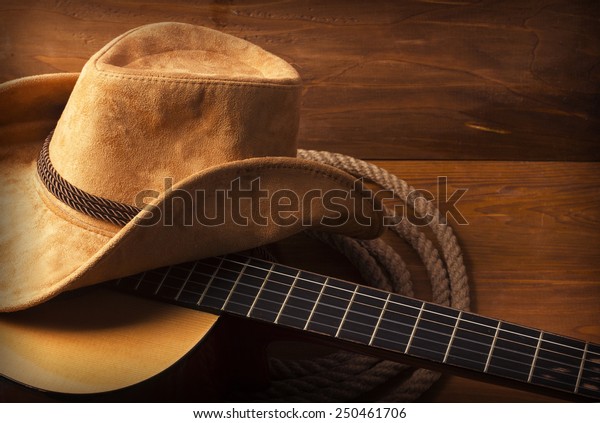 American Country music background with guitar and\
cowboy hat
