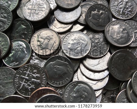 American currency coins, silver dimes, pile of money closeup