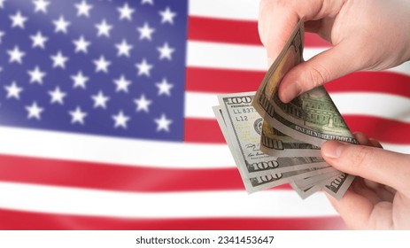 American currency. Dollars in hands. US money. Man counts money. US flag. Financial relations in America. USD payment. United states money. Paper banknotes of dollars. Currency USD. - Shutterstock ID 2341453647