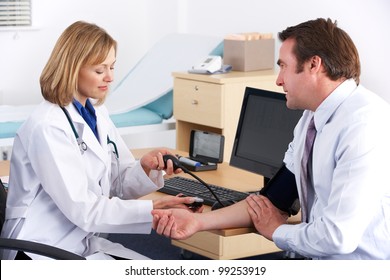 American Doctor Taking Patient's Blood Pressure