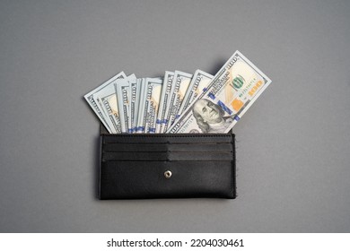 American dollar banknotes stack, pack of money in black wallet, rich, luxury, currency, spending money in crisis, benchmark currency, most used in transactions across the world 