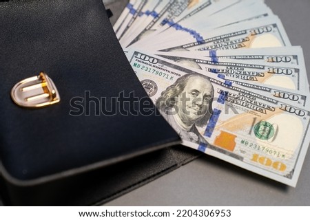 American dollar banknotes stack, pack of money in black bag, rich, luxury, currency, spending money in crisis, benchmark currency, most used in transactions across the world, corruption  