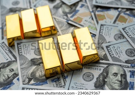 American dollars banknotes with gold bars. Concept of invest or save money