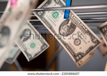 American dollars on a washing line. Money laundering and money from an illegal source Stock photo © 