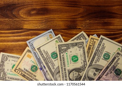American dollars on wooden background. Top view, copy space