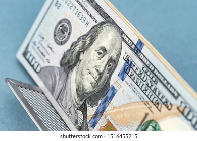 American dollars. A stack of hundred dollar bills. Close up of new hundred dollar banknote.