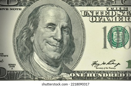 American economy - one hundred dollars banknote with greedy expression - Shutterstock ID 2218090317