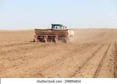 American Falls, Idaho, USA Apr. 17, 2015 A Tractor In The Field Planting Potatoes