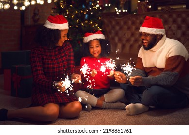 American family in 2023 new year party and merry christmas with 2023 text number on hand at they home - Powered by Shutterstock