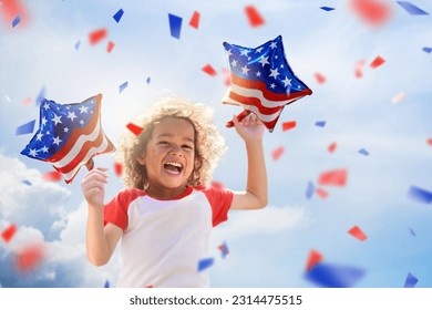 American family celebrating 4th of July. Laughing happy child watching Independence Day fireworks holding US flag balloons. Proud USA kids cheer and celebrate at party. Boy with America symbol.  - Shutterstock ID 2314475515