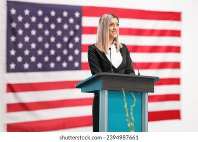 American female politician giving a speech at a podium  - Powered by Shutterstock