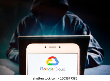 American file hosting service company owned by Google, Google Cloud, logo is seen on an Android mobile device with a figure of hacker in the background.
