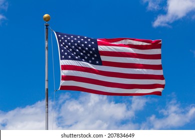 American Flag Against Blue Sky.