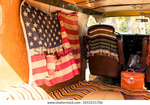 American flag in the\
back of a vintage van
