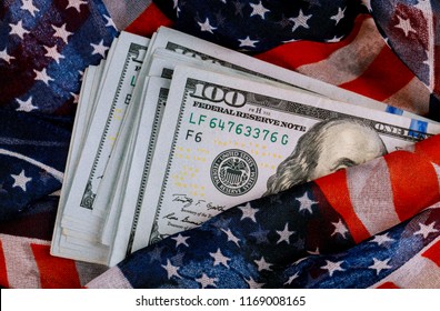 American flag and banknotes USD currency money