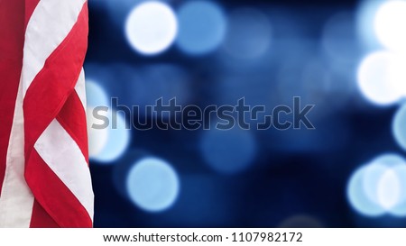 American Flag With Blue Bokeh Lights Background for United States Holidays