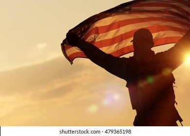 American Flag Celebration. Navy Soldier with United States of America Flag in Hands. Military Concept.