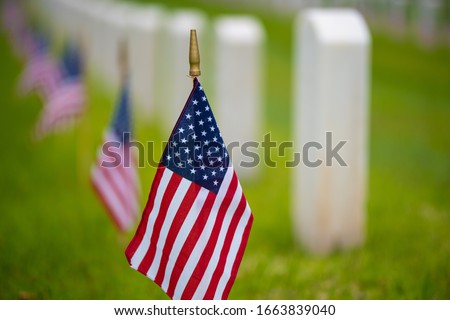An American flag at cemetery on holiday
