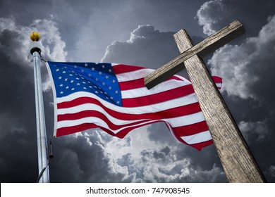 American Flag With A Christian Cross And Dramatic Clouds.