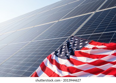 American Flag Close Up On Solar Panels On Solar Power Plant, An Ecological Alternative Source Of Electricity Copy Space