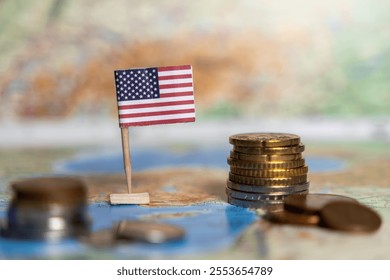 american flag with coins on world map, symbolizing the united states economy, financial system, and global economic influence - Powered by Shutterstock