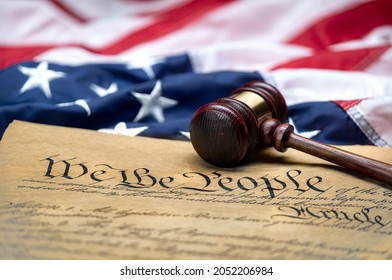 American flag draped around a judge's gavel block and the United States Constitution for use as a symbol of laws, freedom and separation of government powers.
 - Powered by Shutterstock