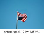 American Flag, Duress, symbol upside down flying on a metal pole. Flying a flag upside down was used by ships that were in distress, and only much later became a symbol of political protest. USA. #1. 