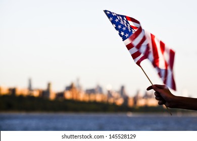 American flag during Independence Day on the Hudson River with a view at Manhattan - New York City (NYC) - United States of America - Powered by Shutterstock