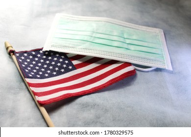 American Flag And Face Mask On Desk