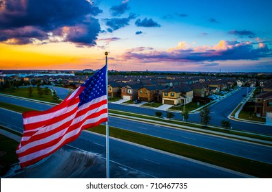 American Flag Flying Above Austin Texas Suburb With Homes And Houses In A Row Perfect America Iconic Suburbia American Homes Living In The USA