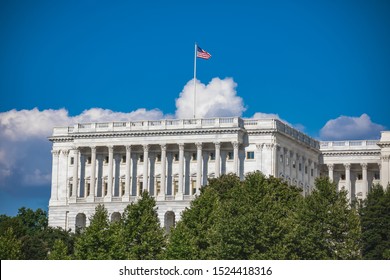 American Flag Flying Over The Exterior Of The Senate Chamber Of The US Capitol Building In Washington, DC